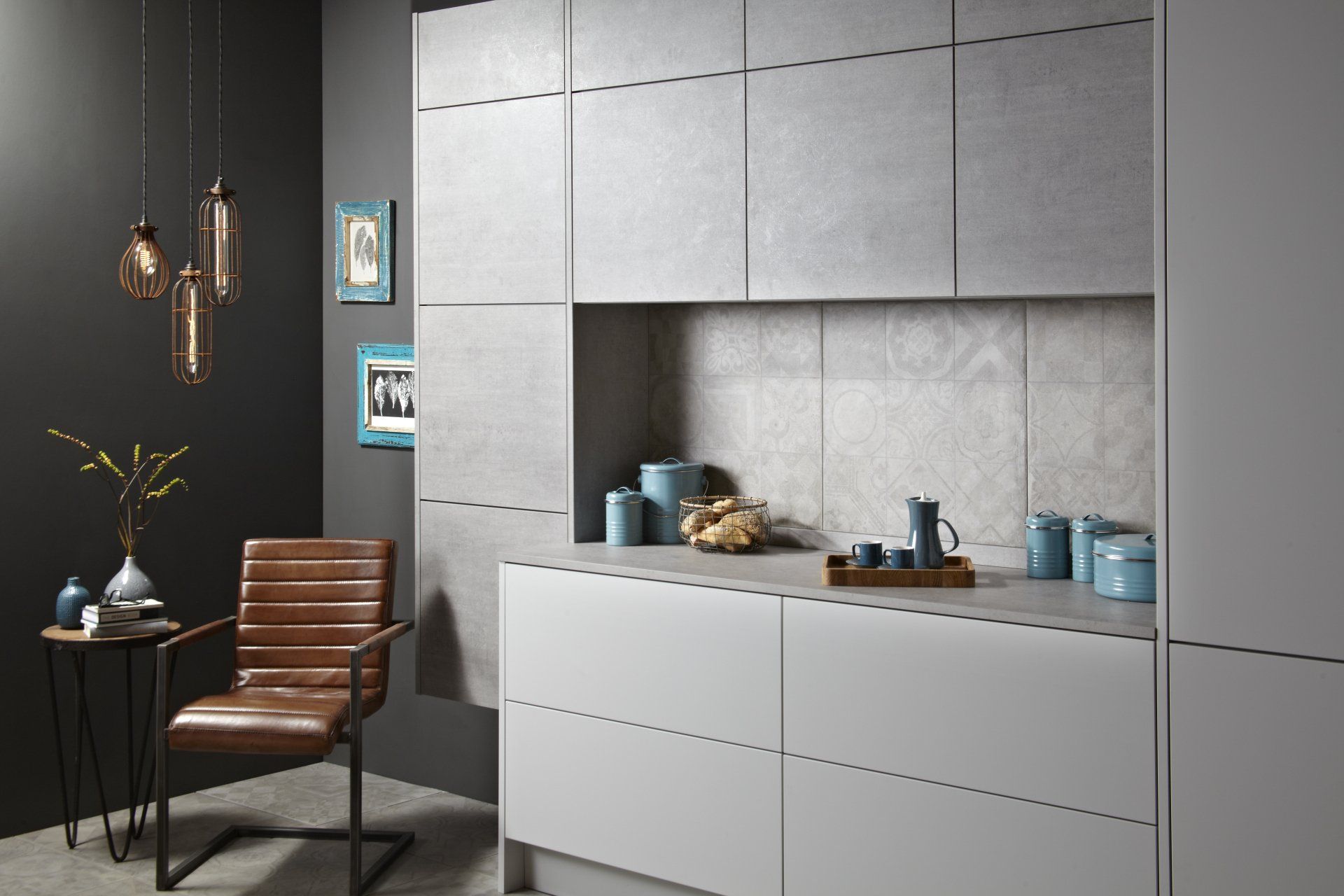 Otto Concrete Kitchen with textured tiles, leather seat and feature light with dark grey walls