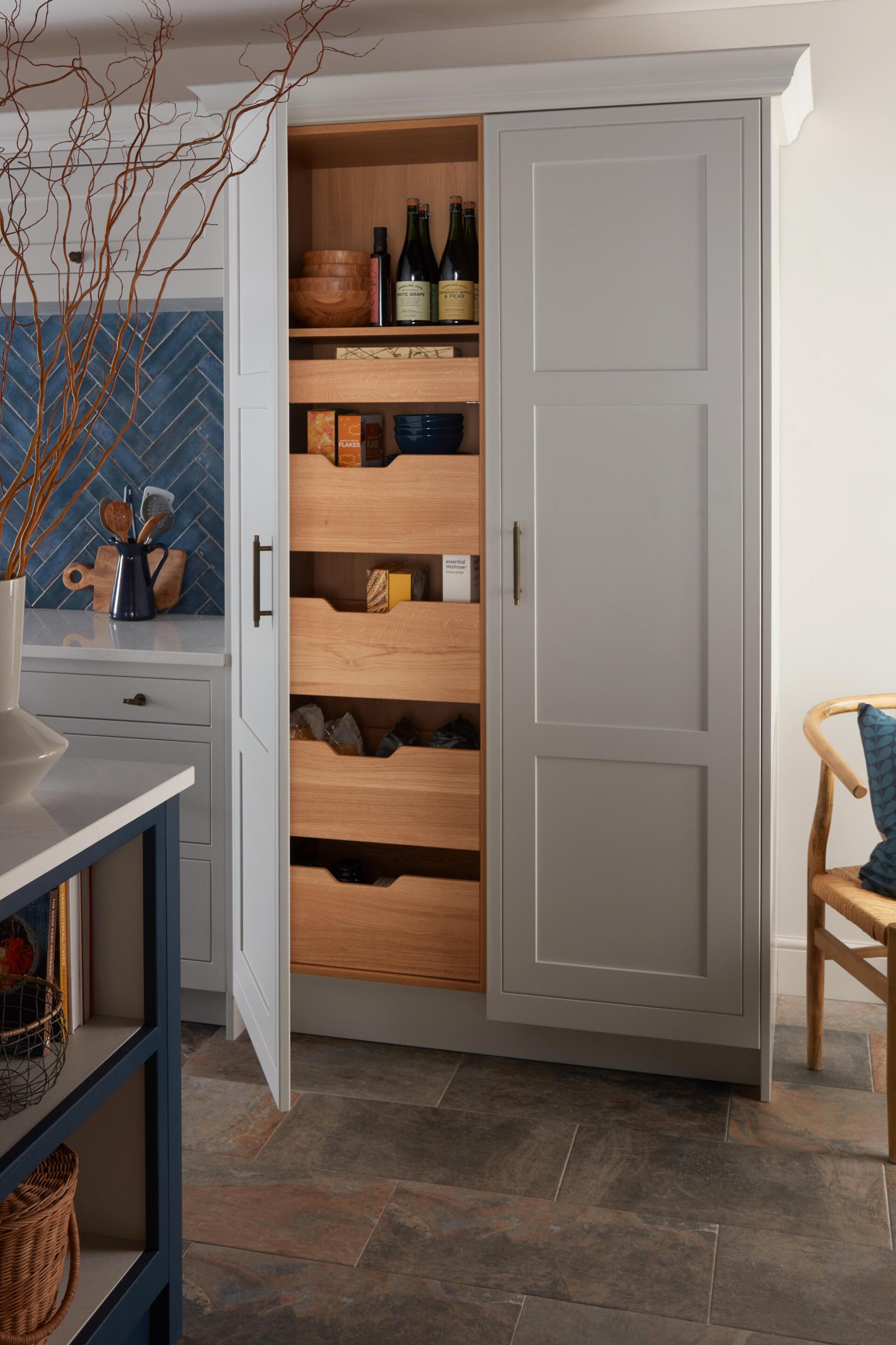 Pembrey Pale Smoke pantry with long doors and wooden internal drawers with groceries