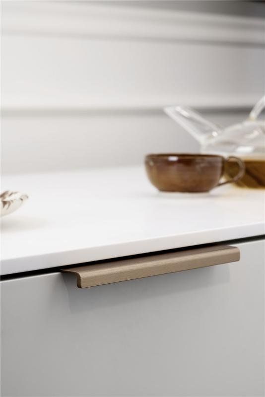Artisan Brass Handle on pale kitchen with white worktop