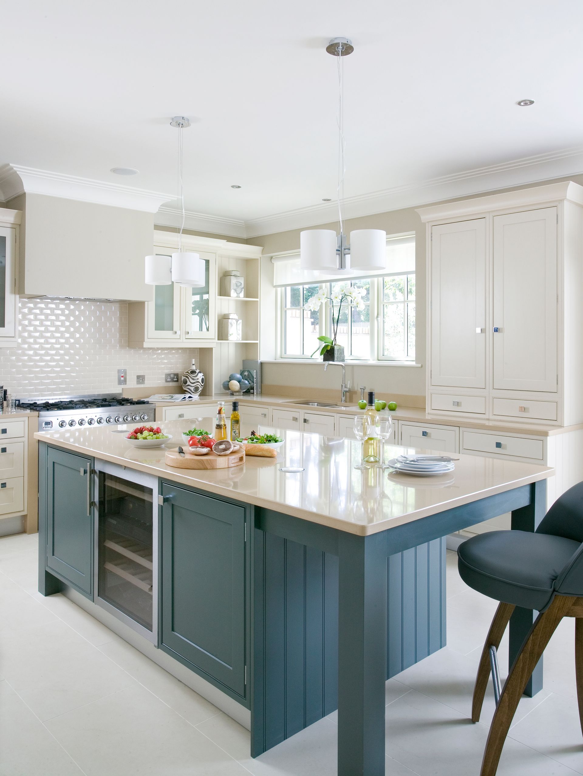 Buckingham kitchen with cream quartz worktops  and hidden extractor in mantle