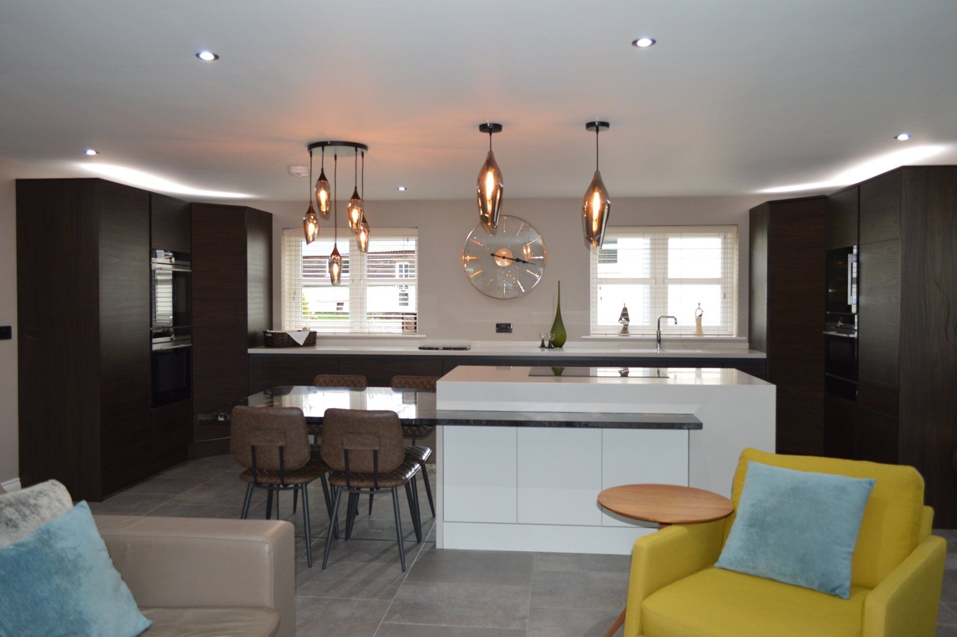 Otto Dark Oak and Porcelain kitchen with floating island, karndean floor, yellow soft chair