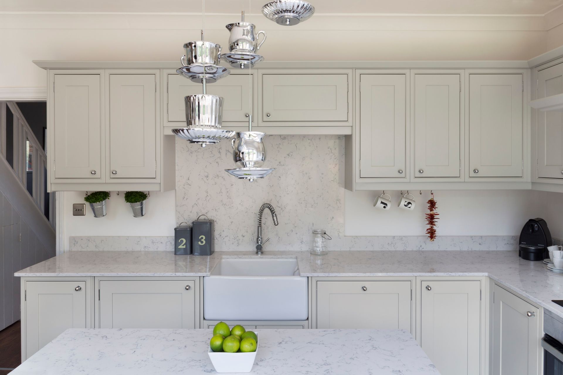 Buckingham kitchen with belfast sink with large quartz splashback on wall behind the sink