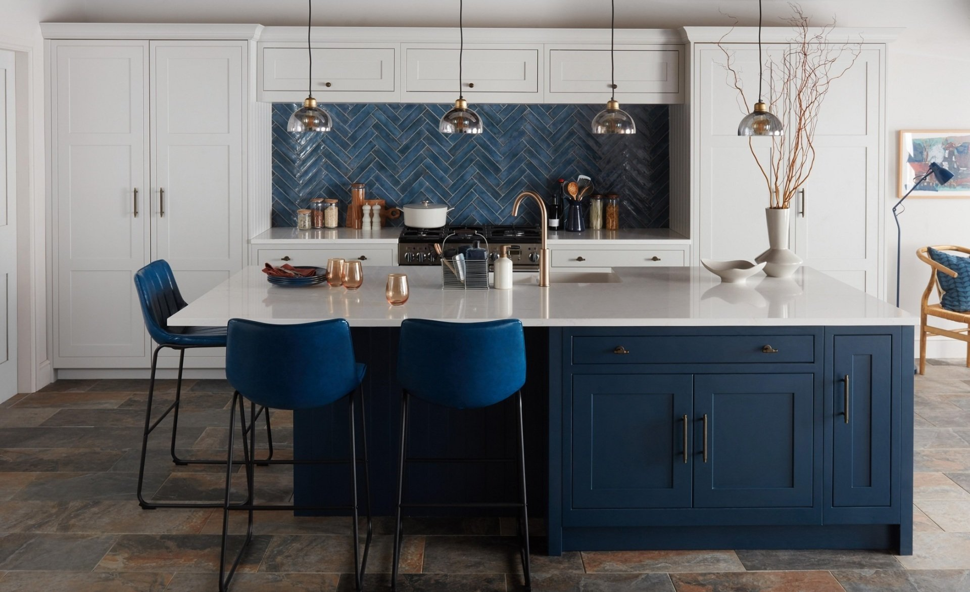 Shaker blue kitchen with large island and quartz worktops, blue tiles
