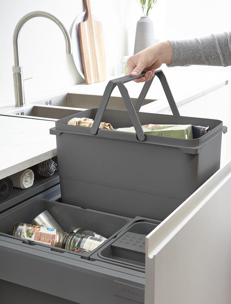 Pull out bin with handles someone lifting it out