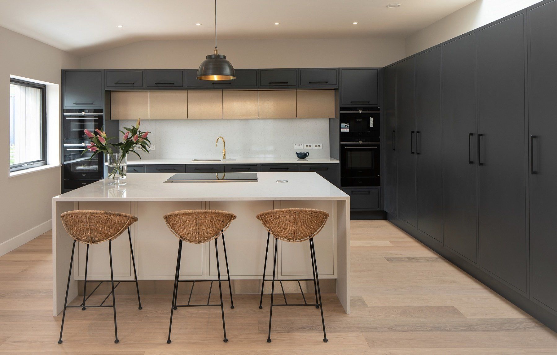 Enfield Graphite kitchen with porcelain island and wicker breakfast bar stools