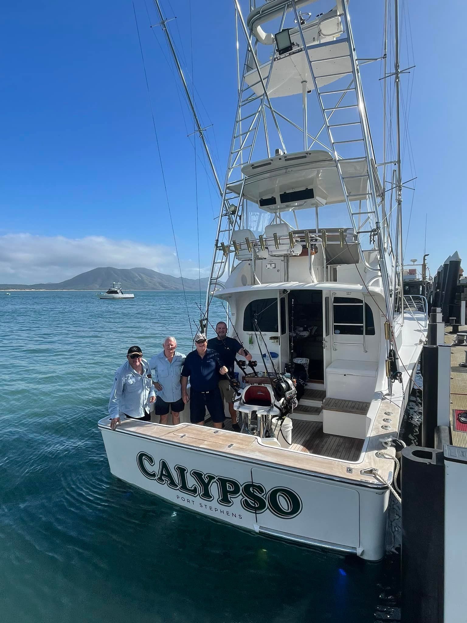 People standing on a boat named 