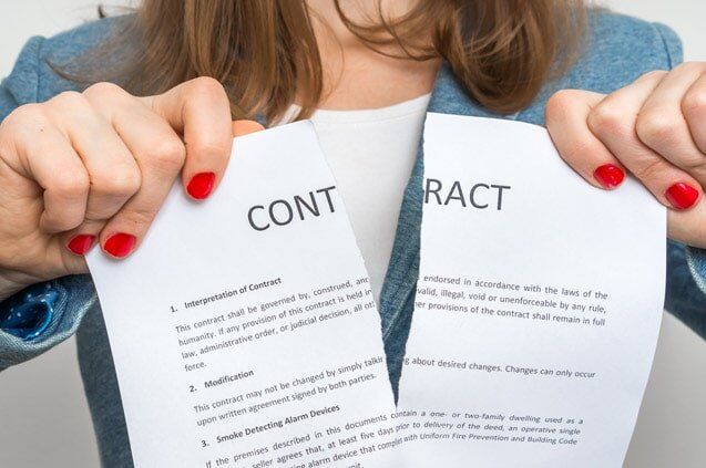 Wrongful Termination  — Woman Ripping Contract Paper in Fresno, CA