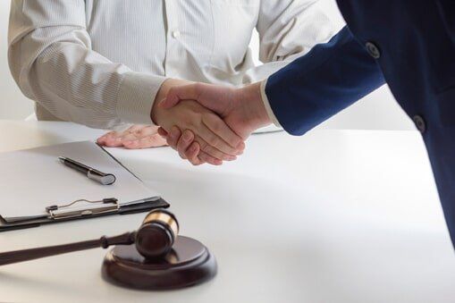 Liability — Lawyer and Client Shaking Hands in Fresno, CA