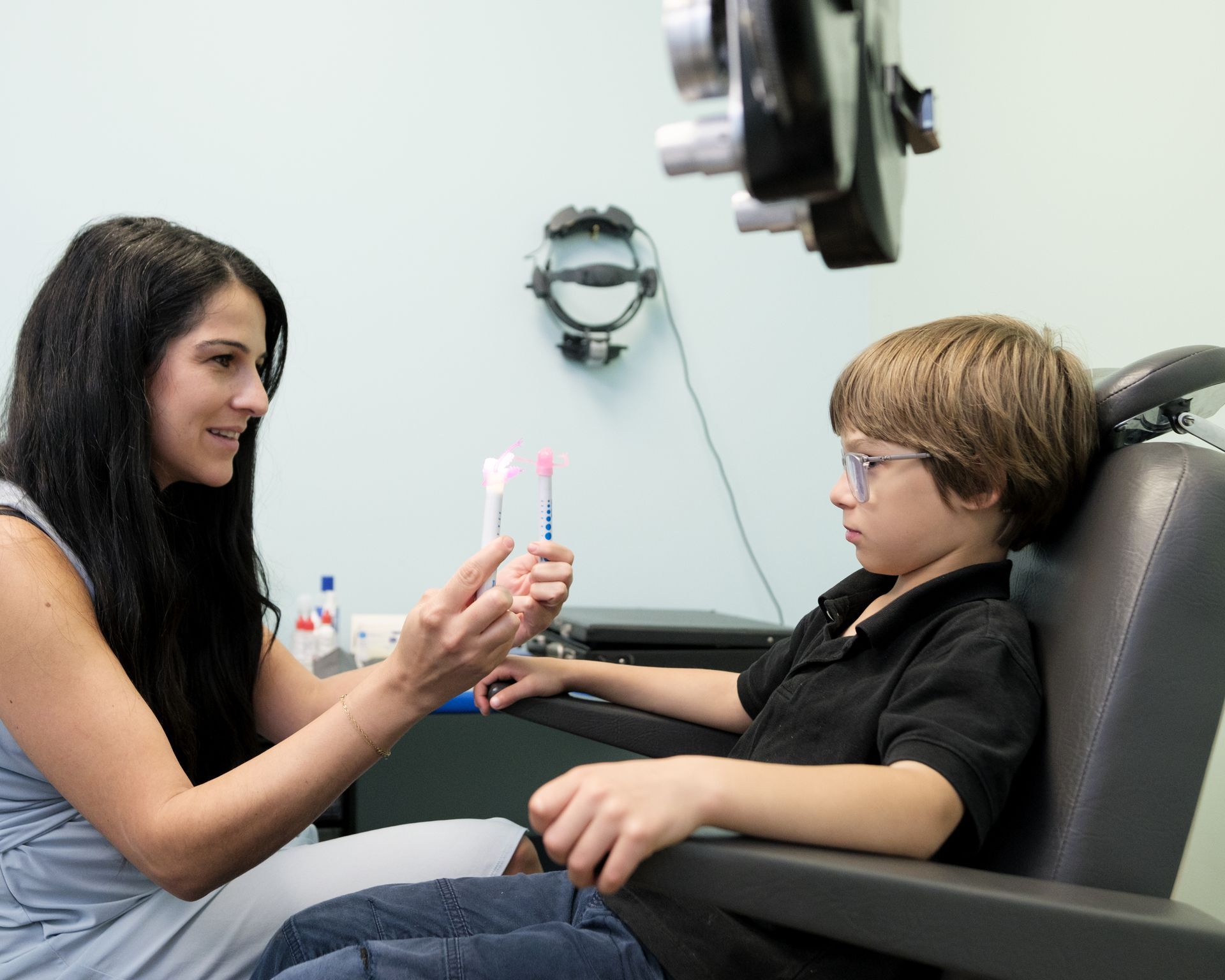boy with glasses doing eye test