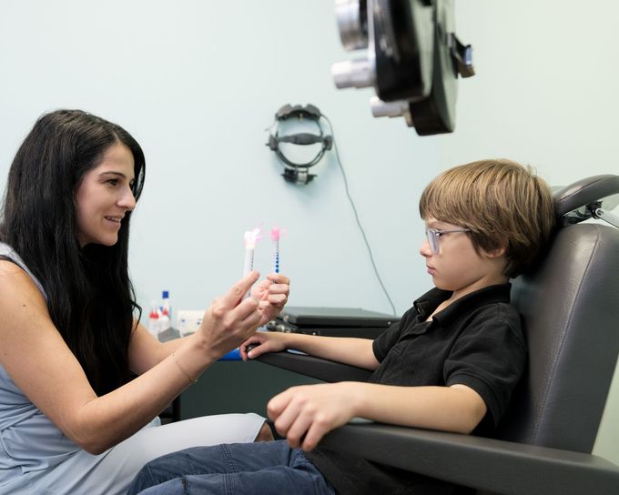 boy with glasses doing eye test