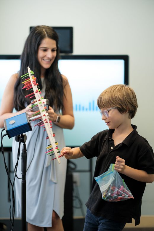 man receiving eye test with light shining in eye