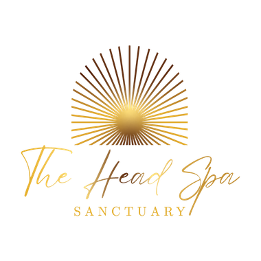 The logo for the head spa sanctuary is a gold sun with rays coming out of it.