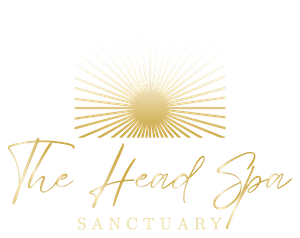 The logo for the head spa sanctuary is a gold sun with rays coming out of it.