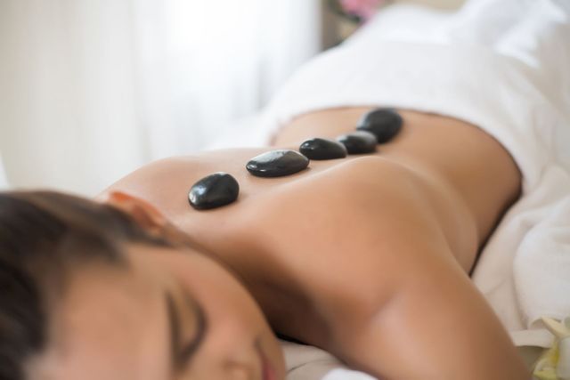 The benefits of hot stone massage therapy - Prana Endura