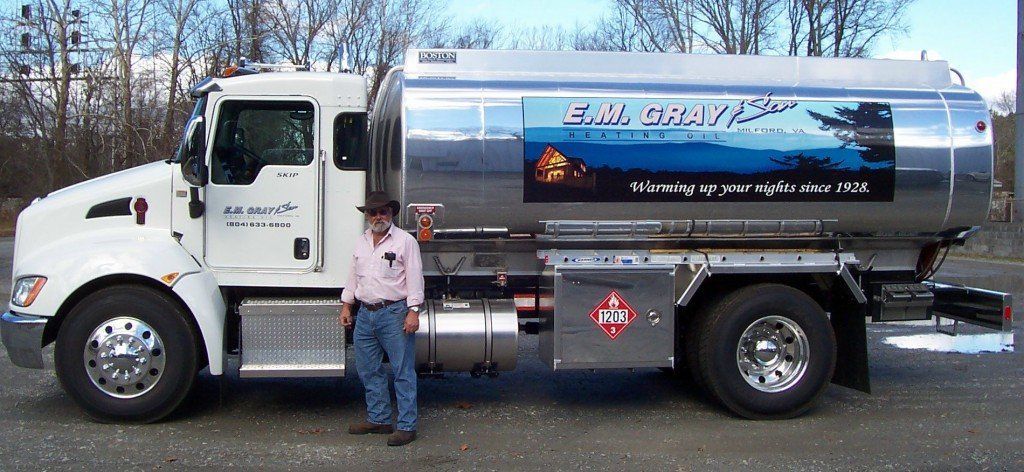 E.M. Gray and Son owner standing in a fuel tanker 