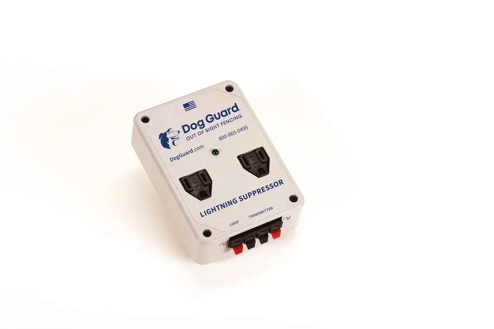 A white, rectangular Dog Guard lightning suppressor box with two outlets and four connection terminals on a white background.