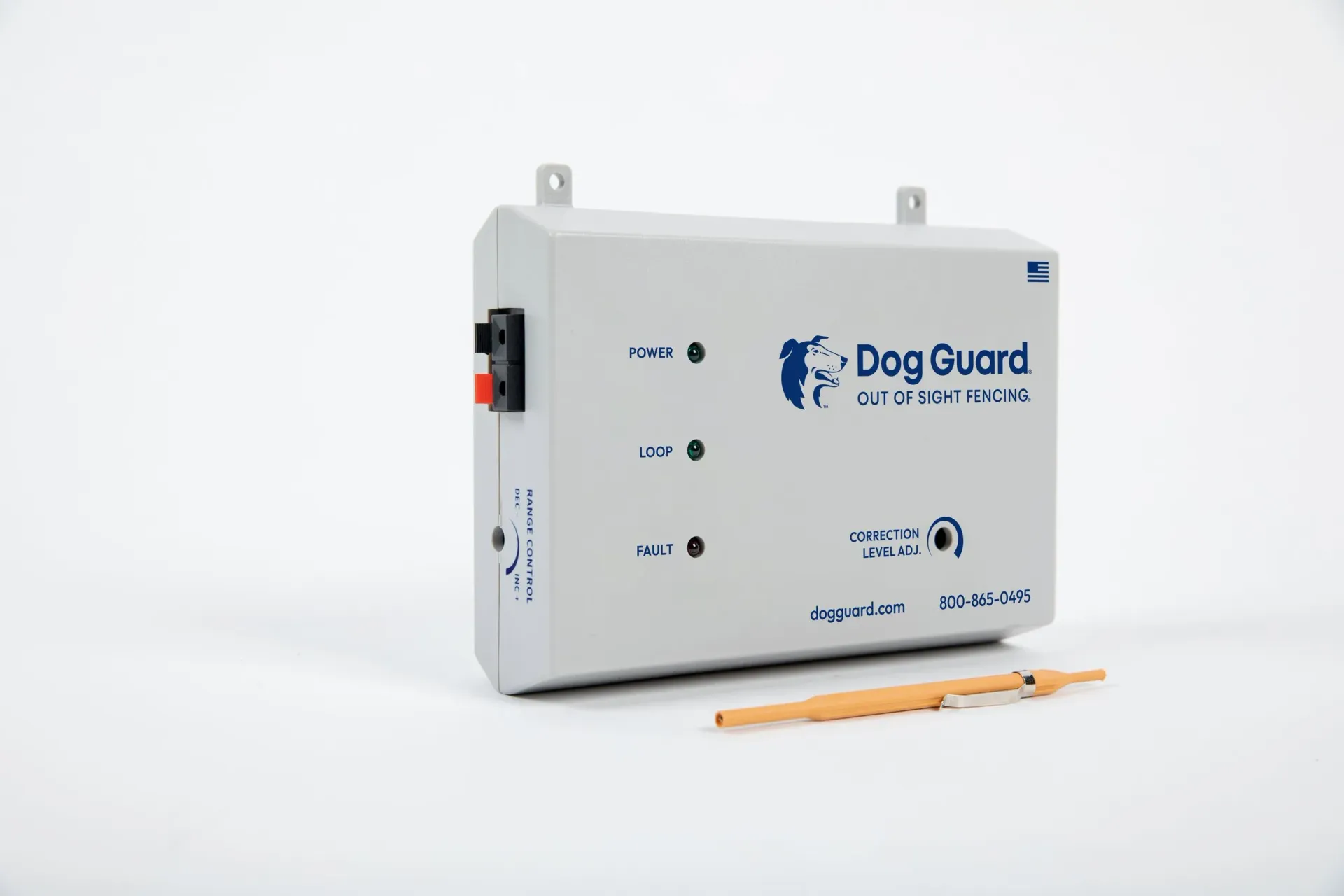 A grey Dog Guard electronic fence transmitter box with indicator lights and a small adjustment tool on a white background.