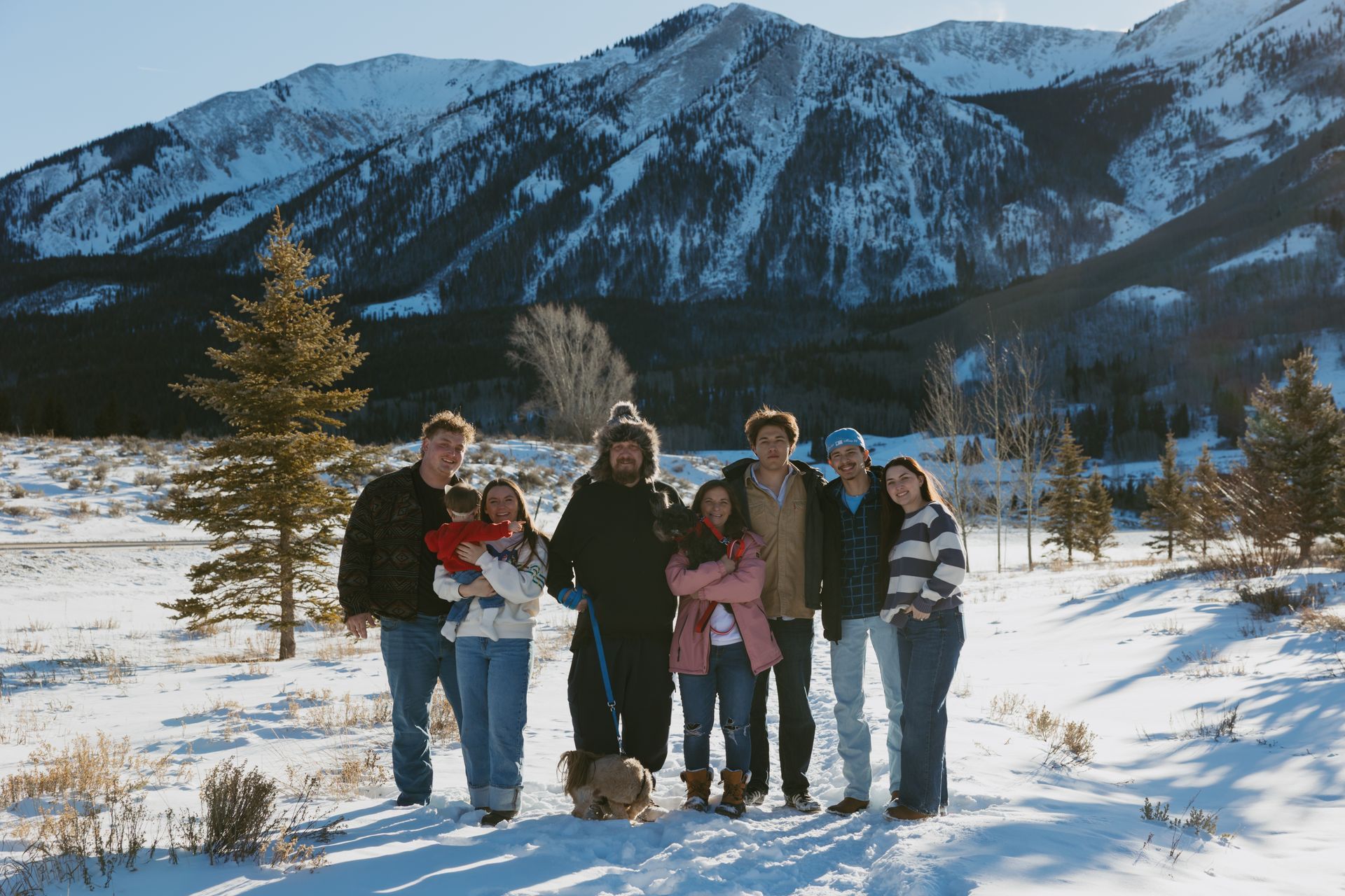 Attic with exposed wooden beams, ductwork, and electrical wiring.