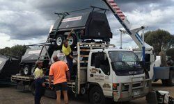 f sparks and sons lifting caravan into truck