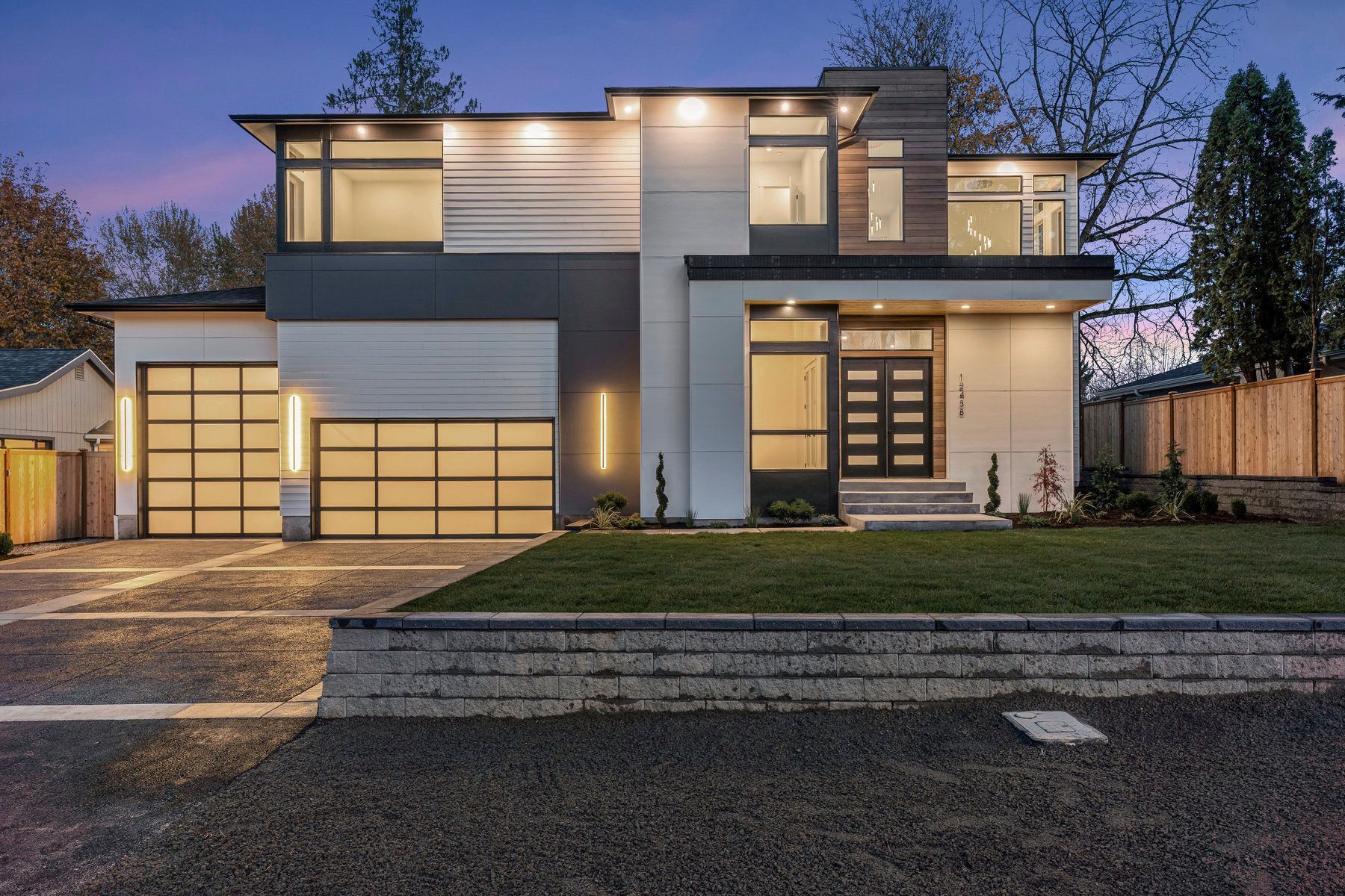 The front of a modern house with a large garage door
