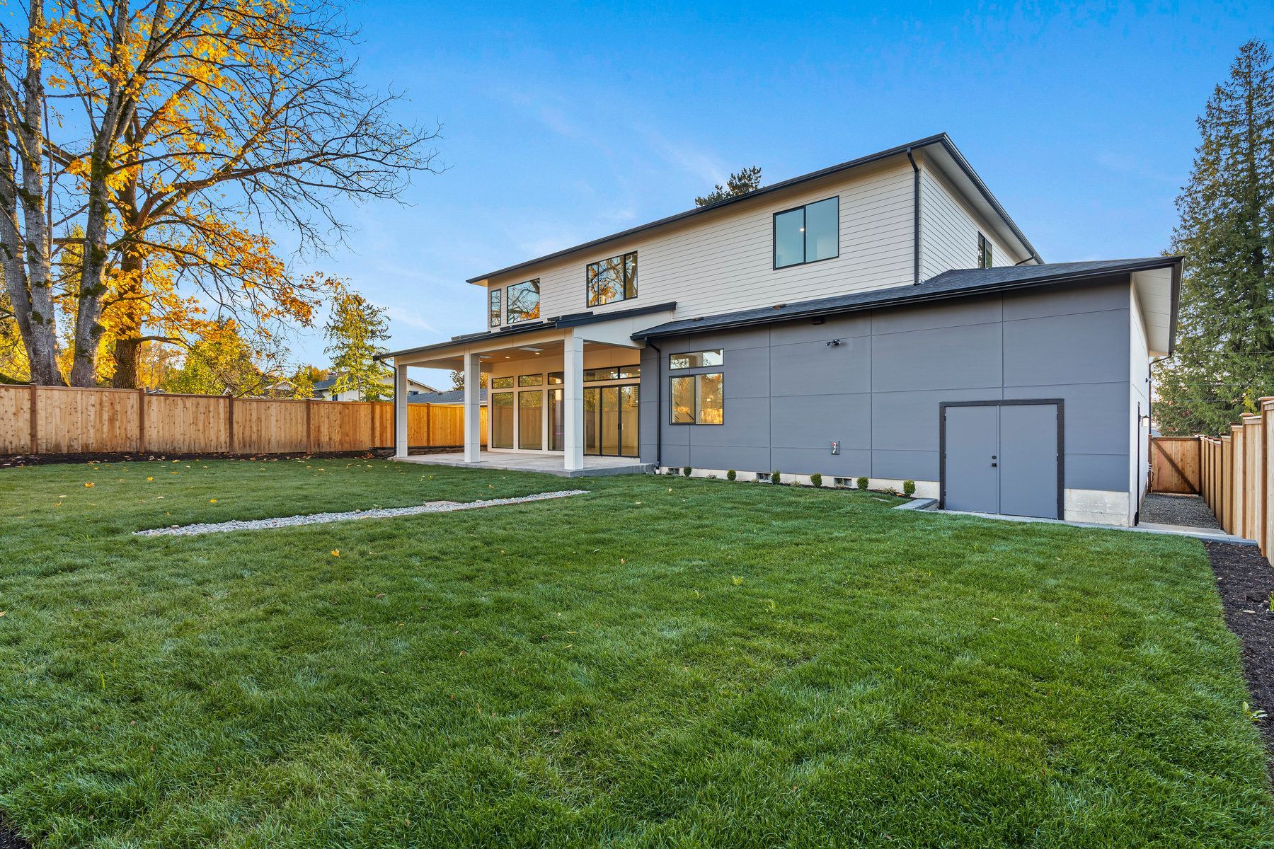 A large house with a large lawn in front of it.