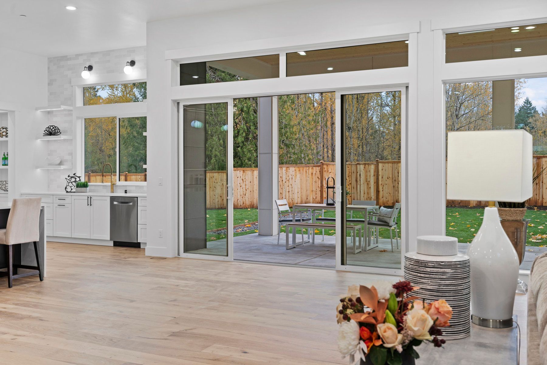 A living room with sliding glass doors leading to a patio.