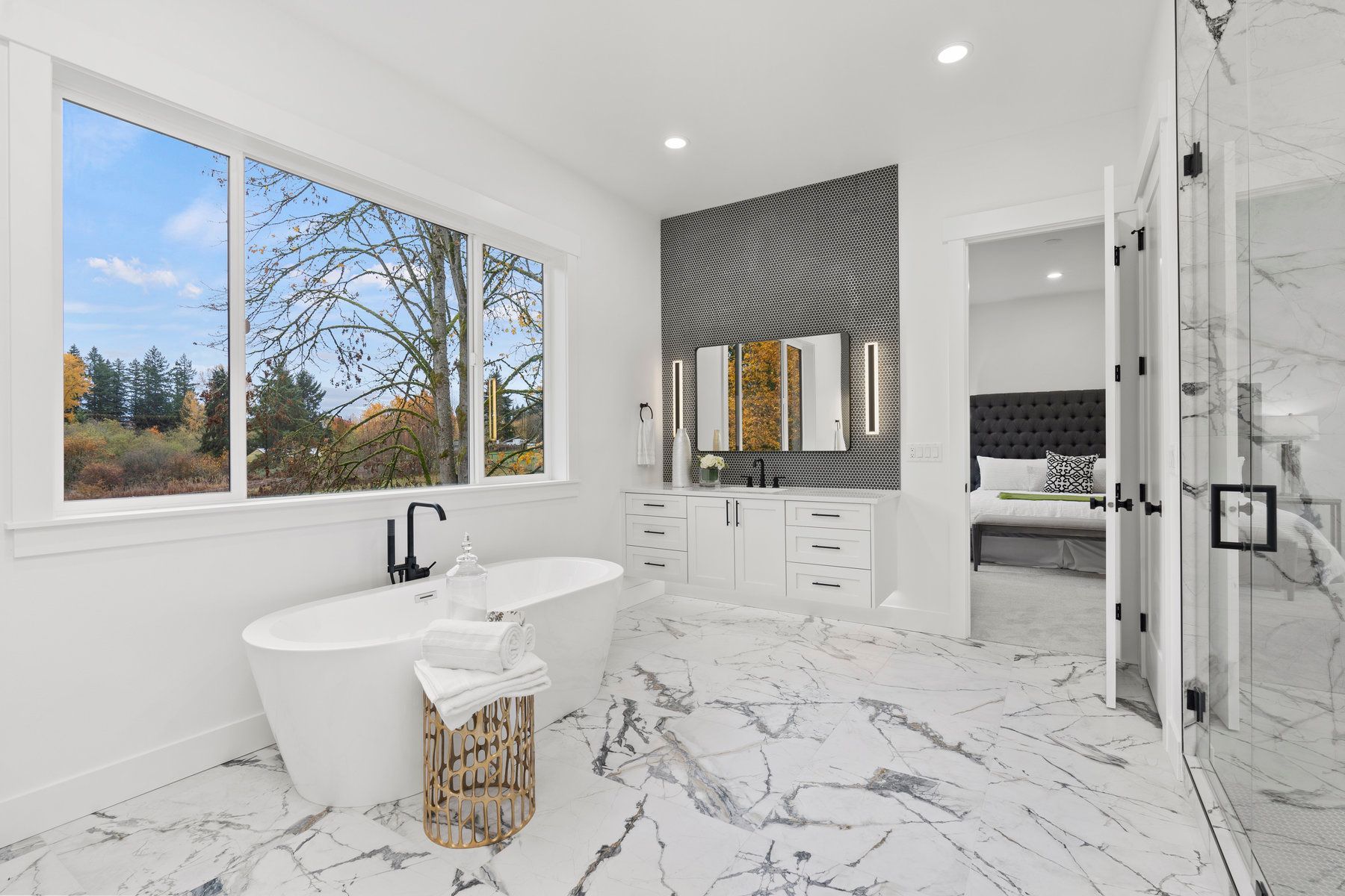 A bathroom with a tub , shower , and window.