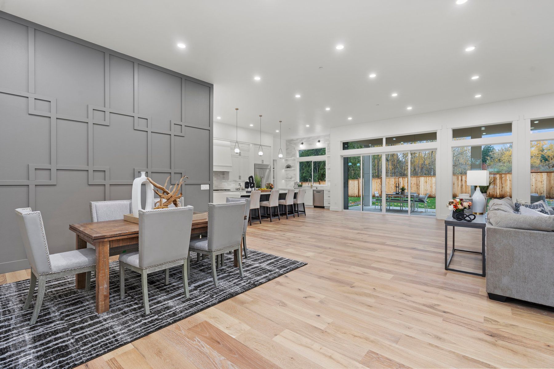 There is a dining room table and chairs in the middle of the room.