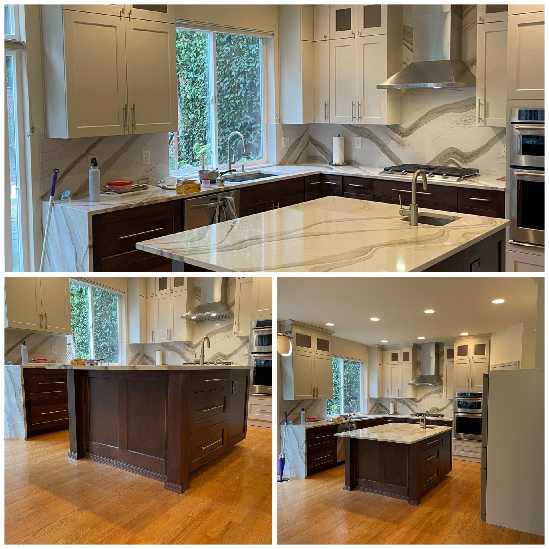 A kitchen with white cabinets and a large island
