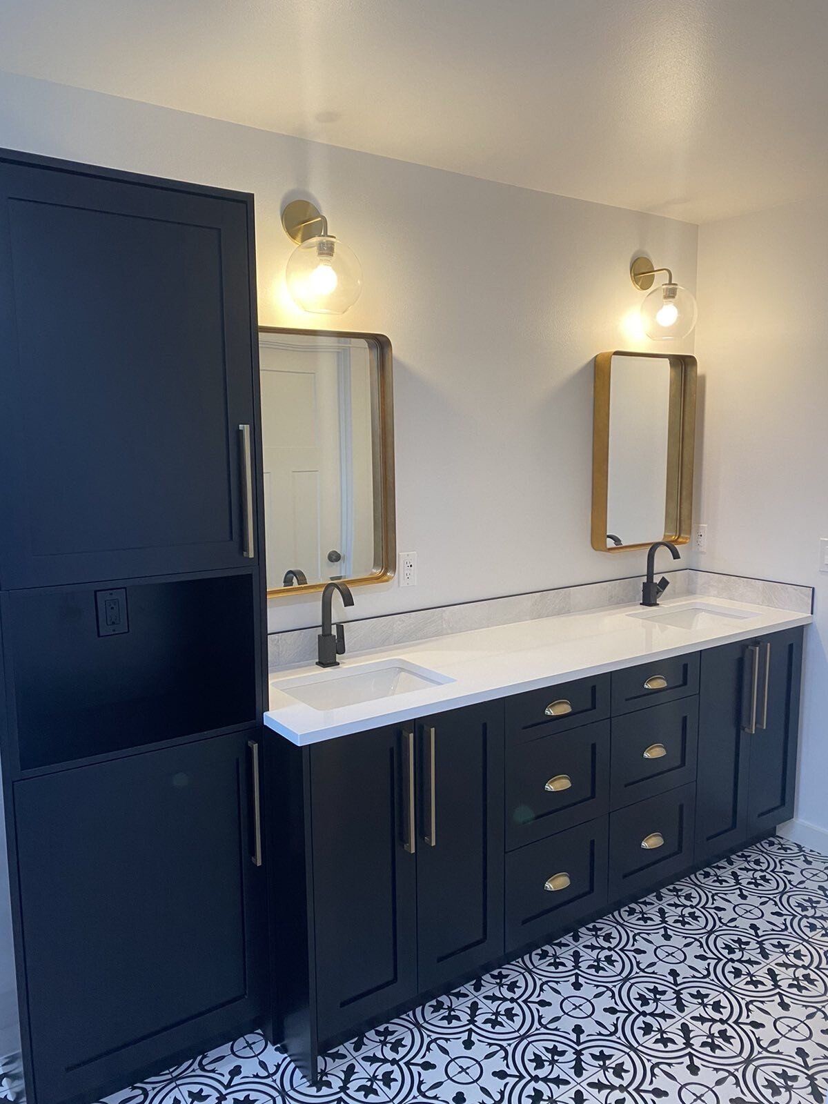 A bathroom with two sinks and two mirrors.