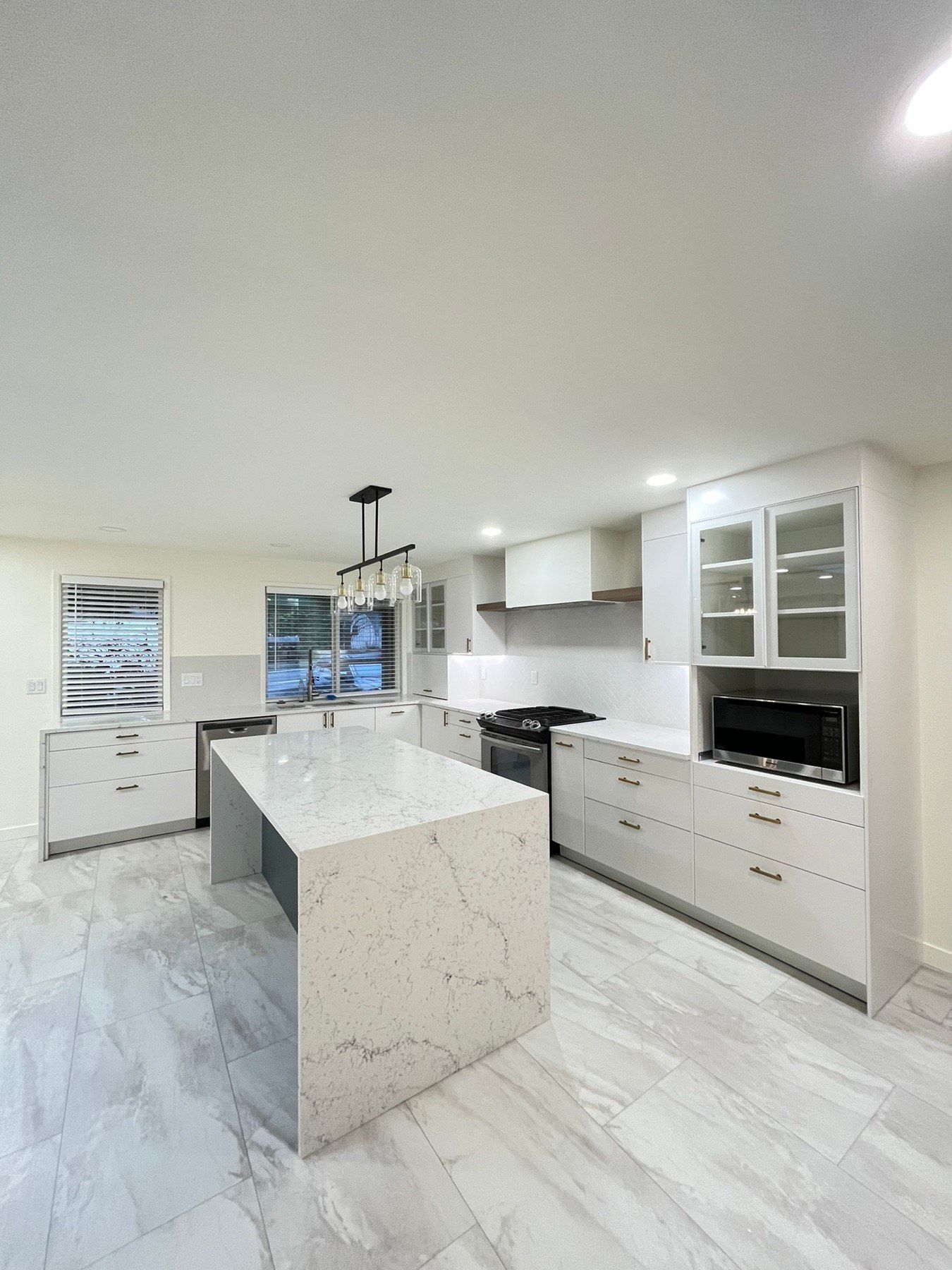 There is a large island in the middle of the kitchen.