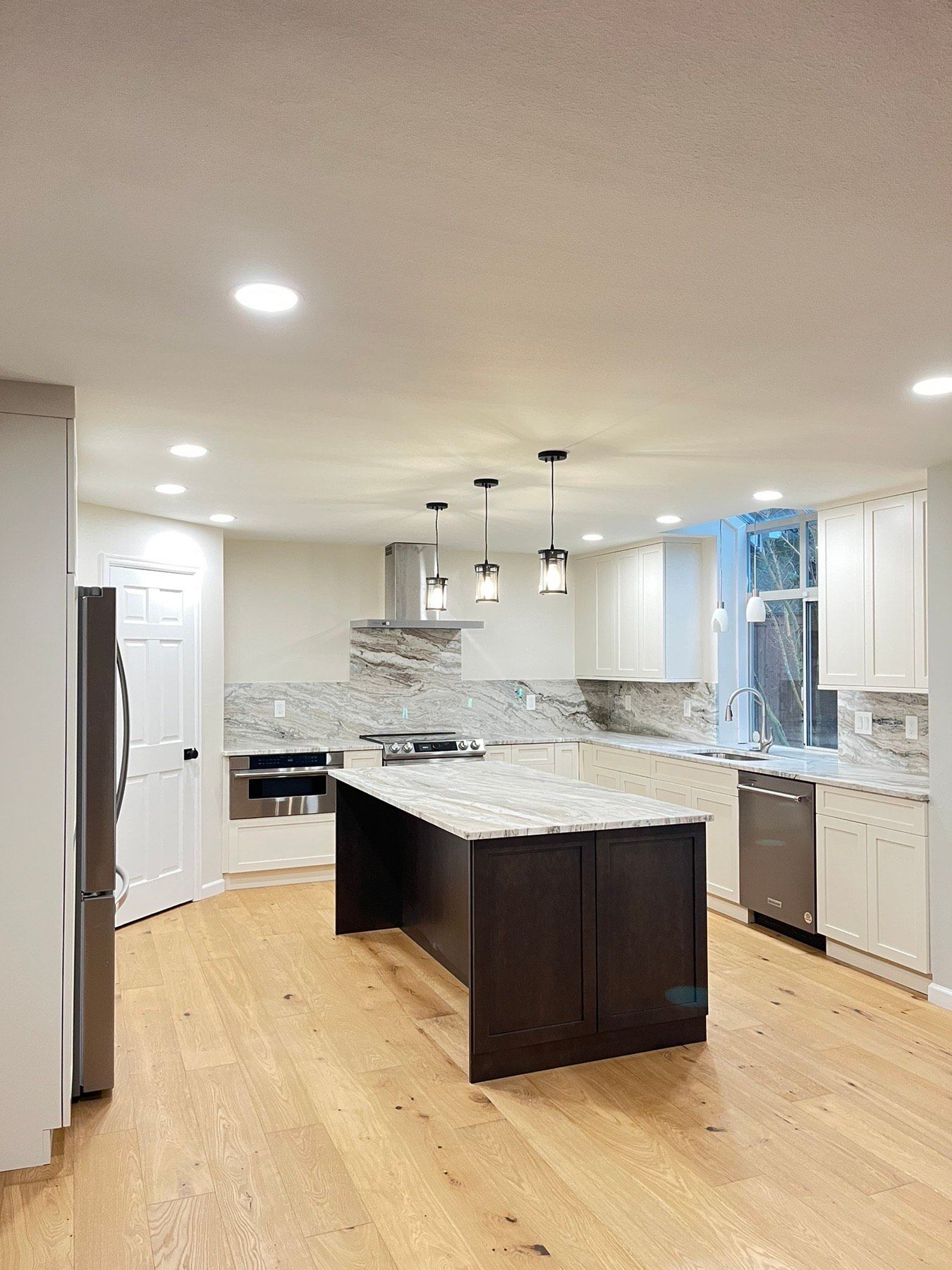 There is a large island in the middle of the kitchen.