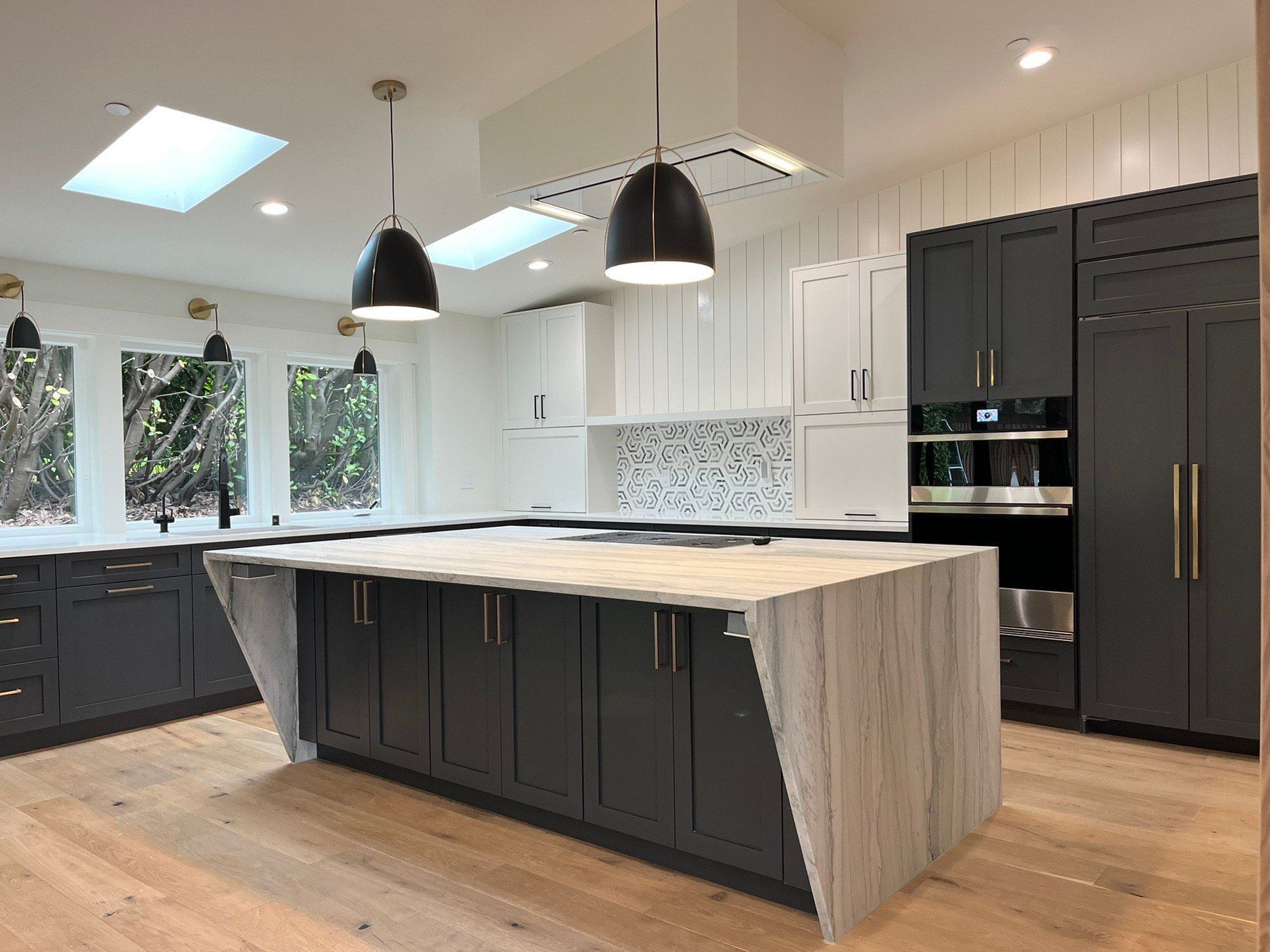 There is a large island in the middle of the kitchen.