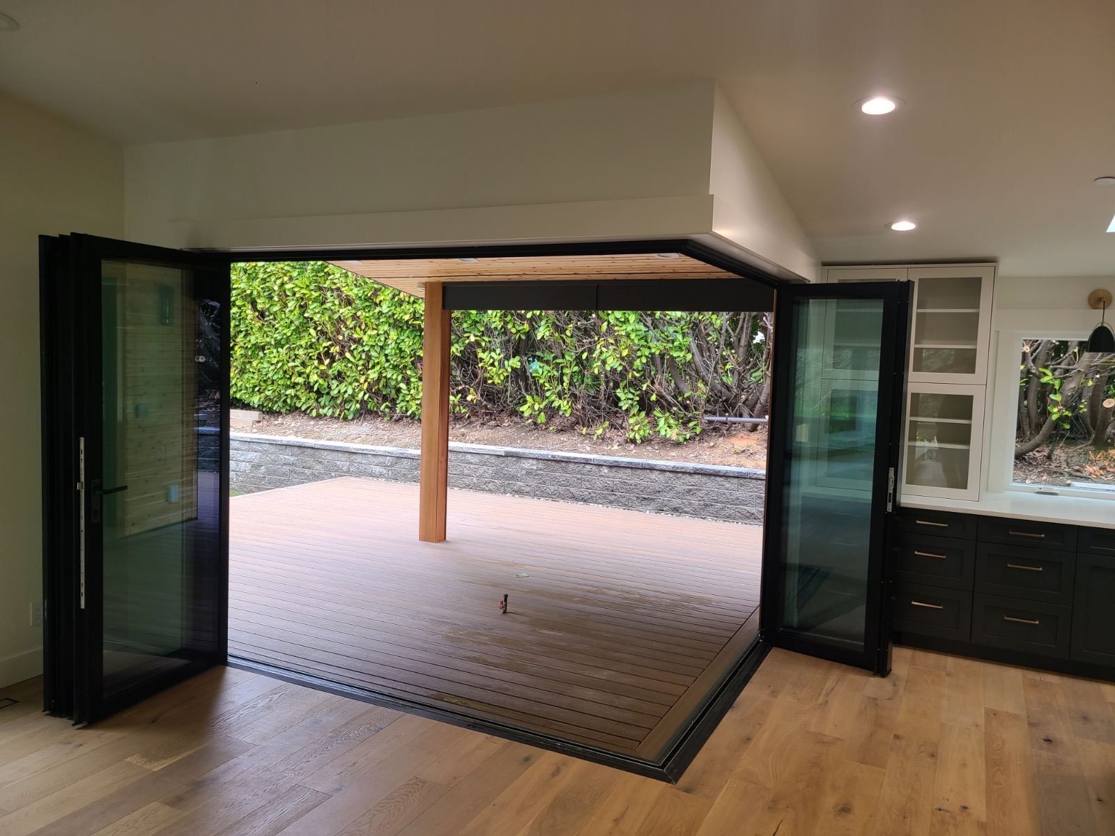 A living room with a patio and sliding glass doors