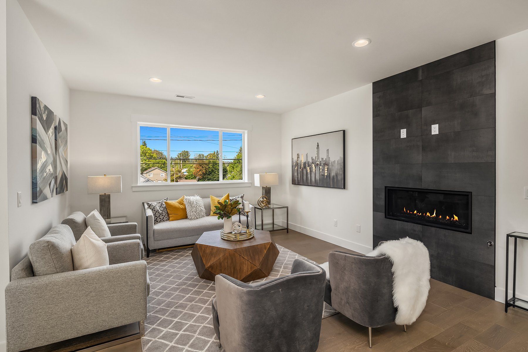 A living room filled with furniture and a fireplace.