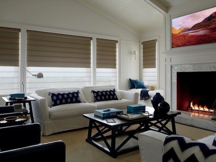 A living room with a fireplace and a couch