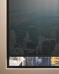 A close up of a window with a view of a city.