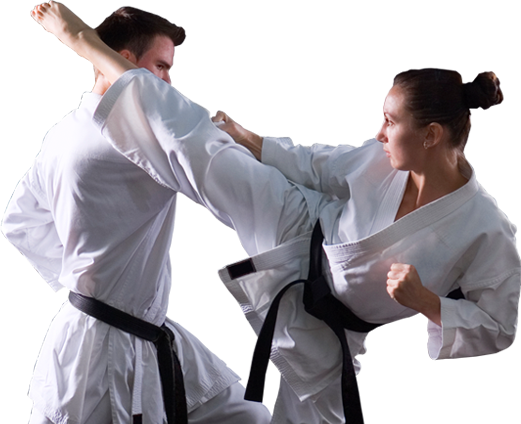 two adults sparring in martial arts