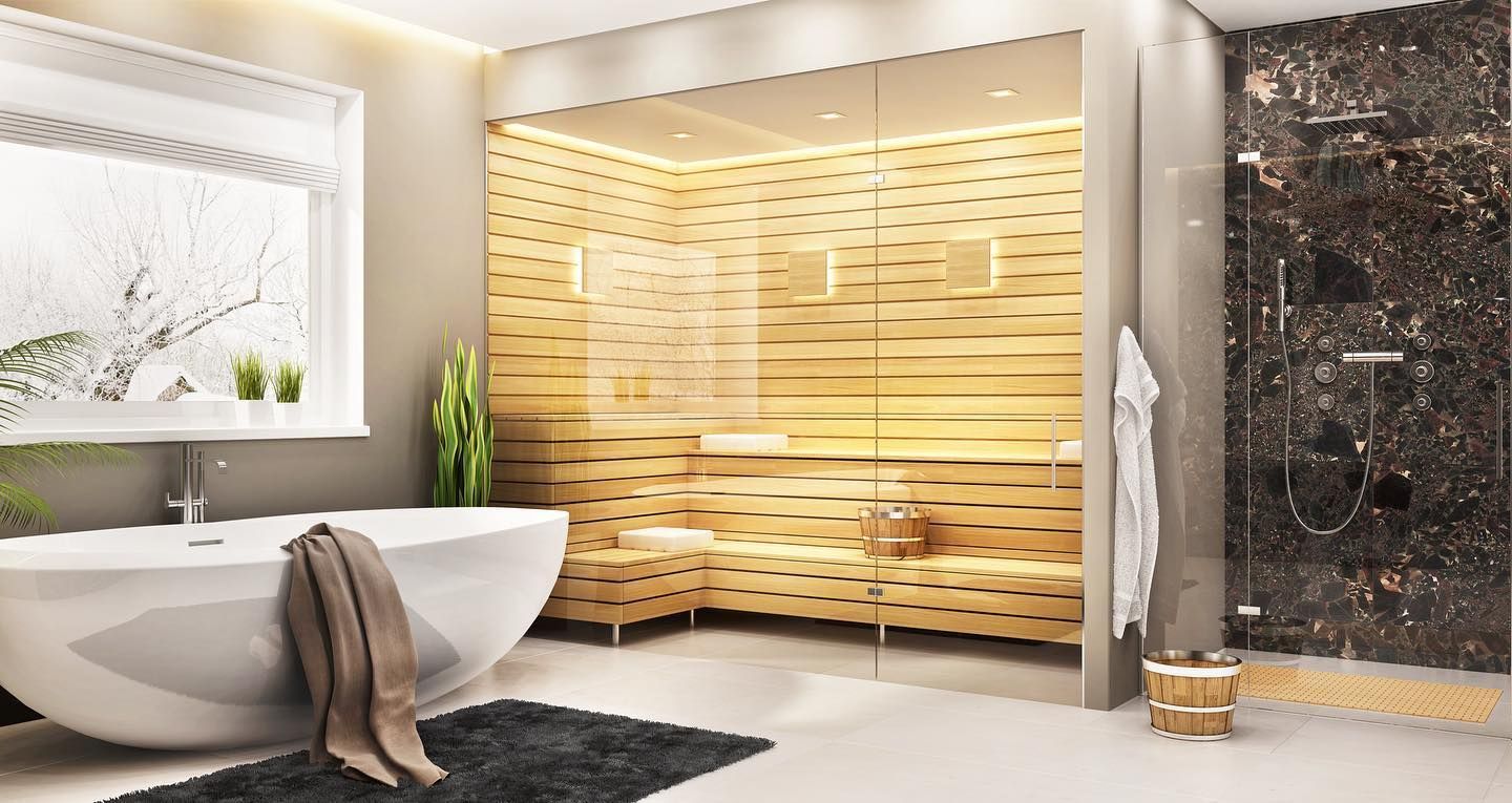 Modern ensuite bathroom with a freestanding bathtub, glass-enclosed sauna