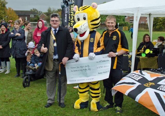 Thatcham Tornado football club presenting Gary with a cheque