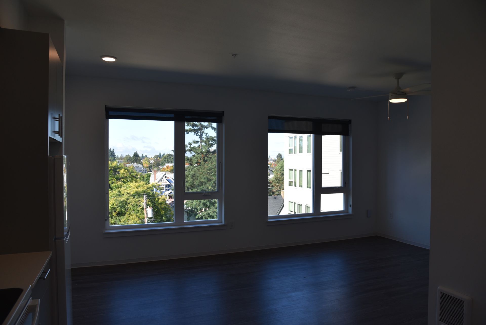 photo of a living rookm with two large windows