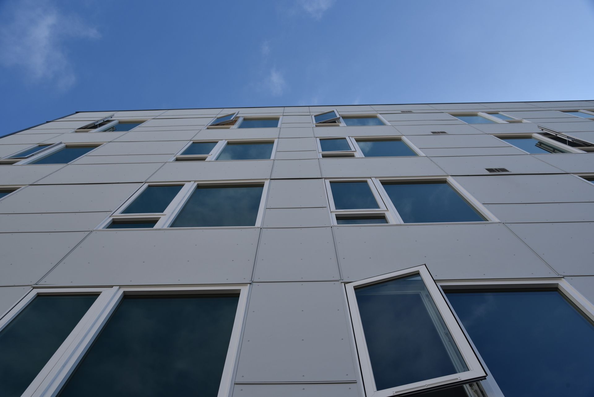 Photo from the sidewalk looking up to the the building
