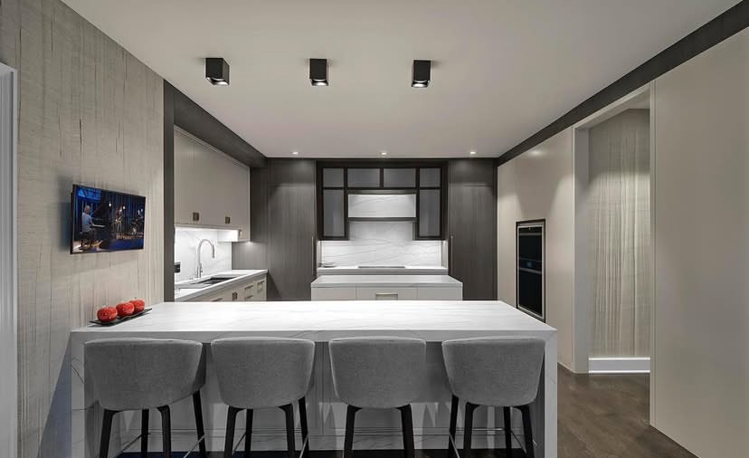 A kitchen with a stainless steel sink and a faucet.