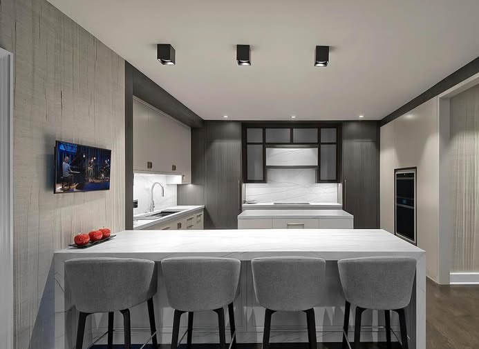 A kitchen with a stainless steel sink and a faucet.