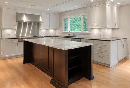 There is a large island in the middle of the kitchen.