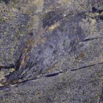 A close up of a purple granite counter top.
