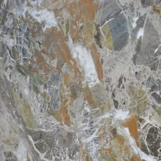 A close up of a marble tile with a spider web on it.