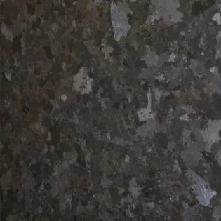 A close up of a black granite counter top.