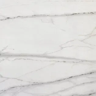 A close up of a white marble counter top.