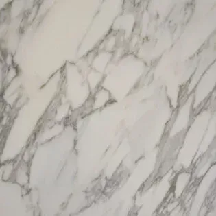 A close up of a white marble counter top.